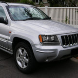 For 1999 - 2004 Jeep Grand Cherokee Headlights -Black Housing / Clear Lens / Amber Reflectors