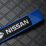 Nissan Set Blue Keychain Metal Key Ring with Black Carbon Fiber Look Seat Belt Covers