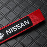 Nissan Set Red Keychain Metal Key Ring with Black Carbon Fiber Look Seat Belt Covers