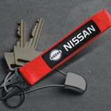Nissan Set Red Keychain Metal Key Ring with Black Carbon Fiber Look Seat Belt Covers